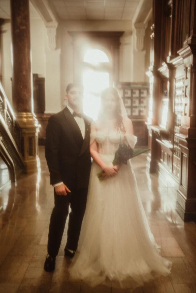 couple in Broad st post office standing like they are ghosts with hazy filter