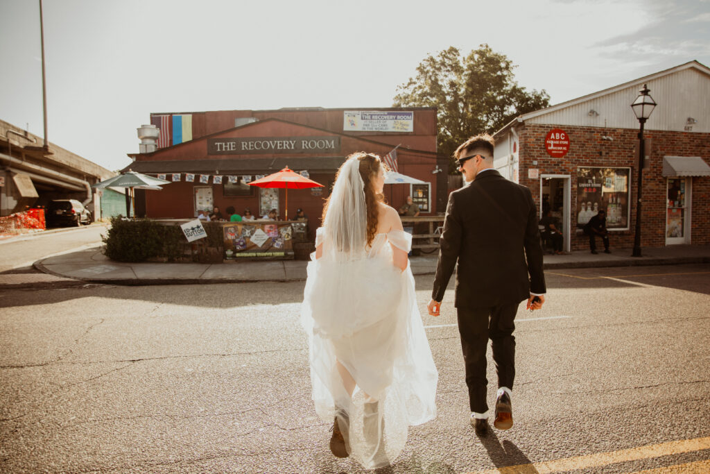 newlyweds walking to a dive bar in Charleston SC