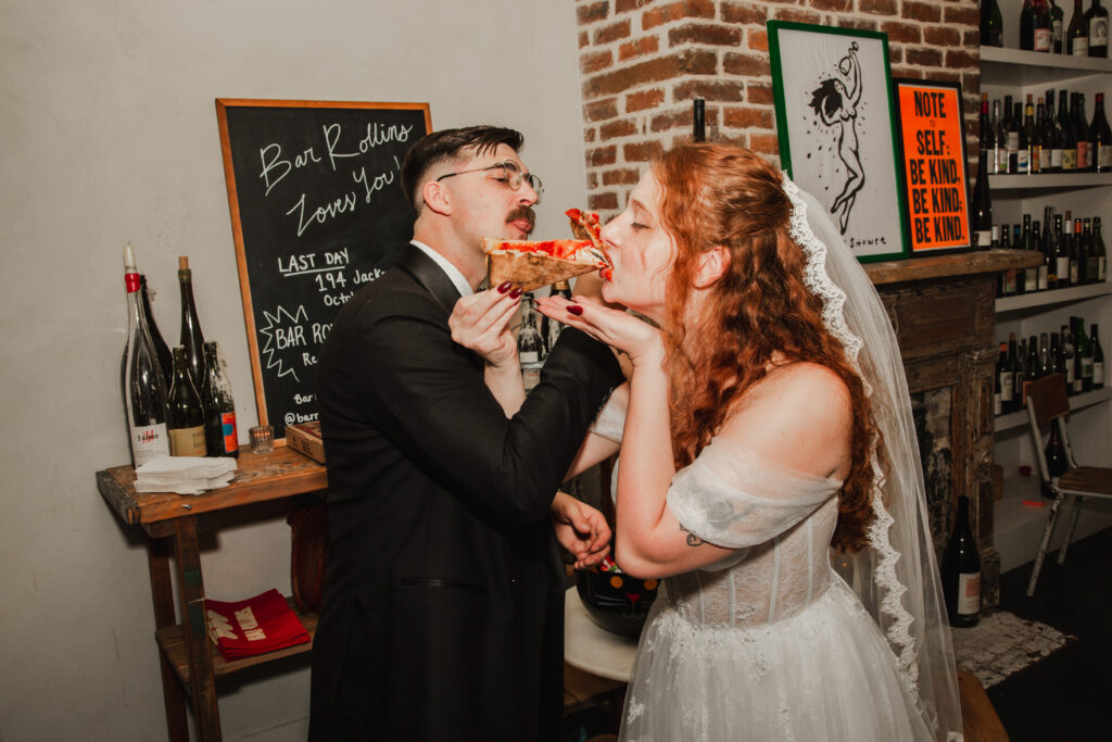 newlyweds eating pizza