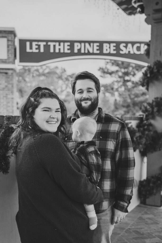 mom and dad and baby smiling